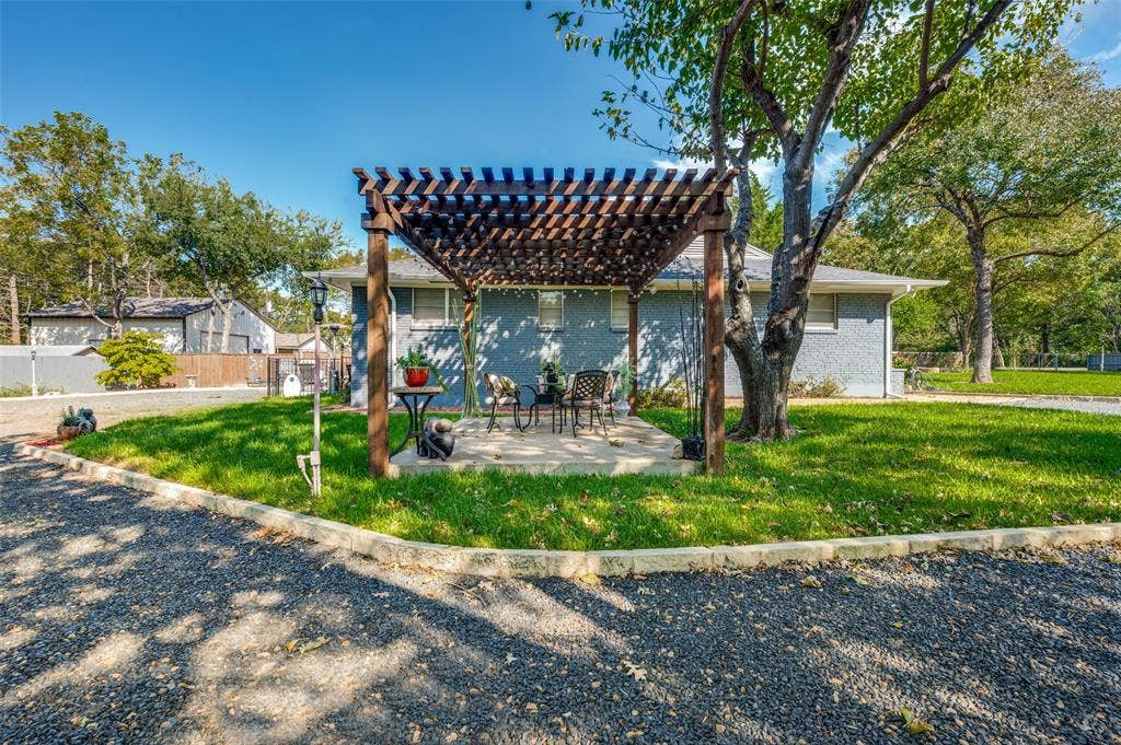 5307 Moneta Lane, Dallas, TX 75236 As you approach the house, don't miss this adorable courtyard with pergola.