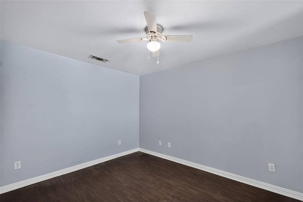 1708 Timber View Drive, Tyler, TX 75703 Room featuring wood-finish flooring, light-toned walls, and a ceiling-mounted light fixture with a fan