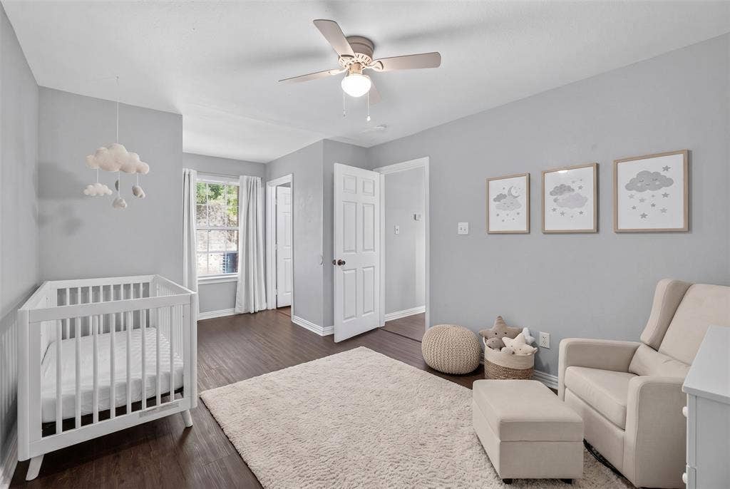1708 Timber View Drive, Tyler, TX 75703 Interior room featuring wood-finish flooring, a ceiling fan with integrated lighting, and a multi-pane window