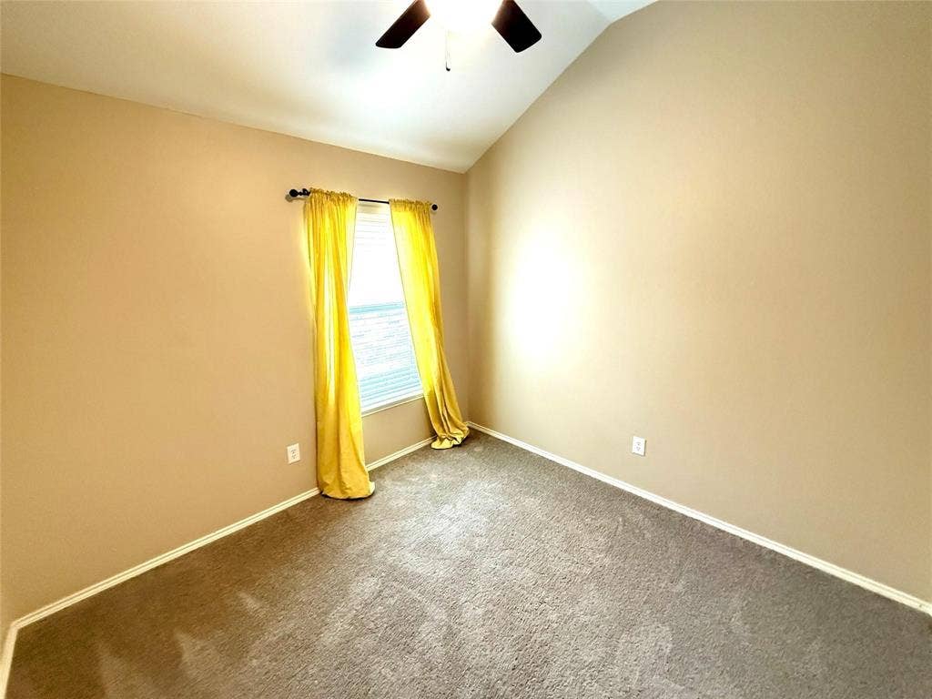 2111 Red River Road, Forney, TX 75126 Vaulted ceilings, carpeted flooring, and a single-light window featuring a fixed curtain rod