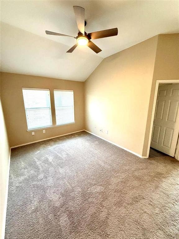 2111 Red River Road, Forney, TX 75126 Vaulted ceilings with a central ceiling fan and light fixture, neutral wall finishes, carpeting, and dual-pane windows