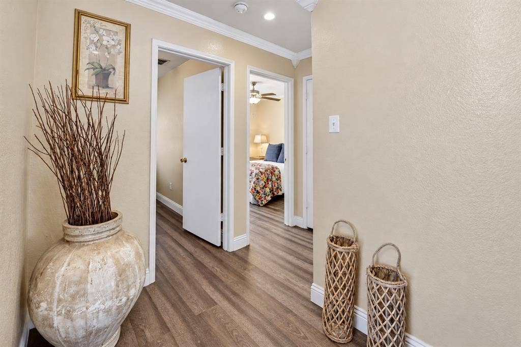 413 Bonnie Court, Anna, TX 75409 Interior hallway featuring wood-finish flooring, crown molding, and recessed lighting