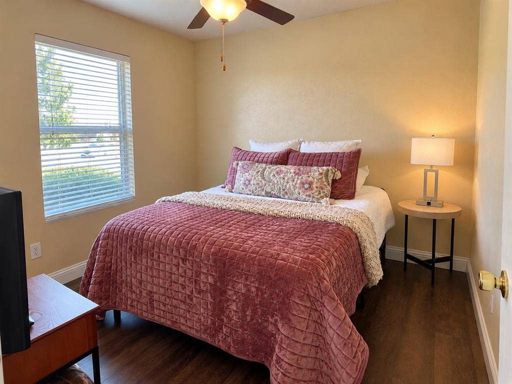 413 Bonnie Court, Anna, TX 75409 Room featuring wood-finish flooring, a ceiling fan with integrated lighting, and a window with horizontal blinds