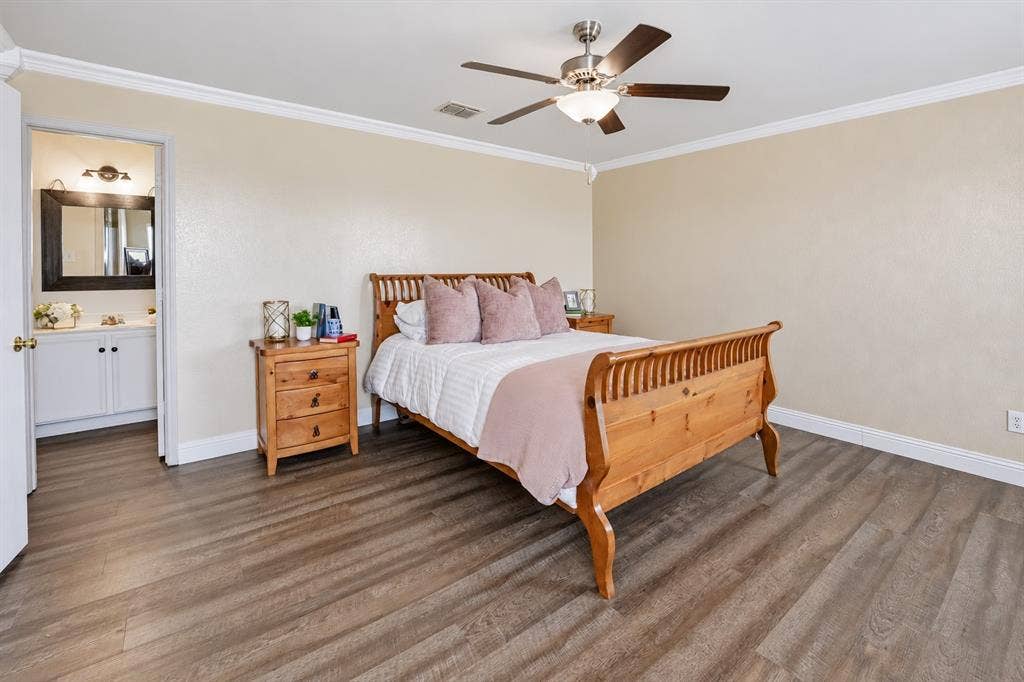 413 Bonnie Court, Anna, TX 75409 Room featuring wood-finish flooring, crown molding, and a ceiling fan with integrated light fixture