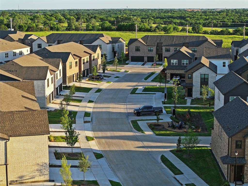 1525 FM 982, #4310, Princeton, TX 75407 Aerial view of residential area featuring a heavily wooded area