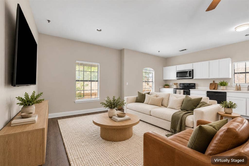 2410 S 2nd Street, #625, Waco, TX 76706 Open-concept living space featuring wood-finish flooring, recessed lighting, white cabinetry, integrated appliances, and arched windows