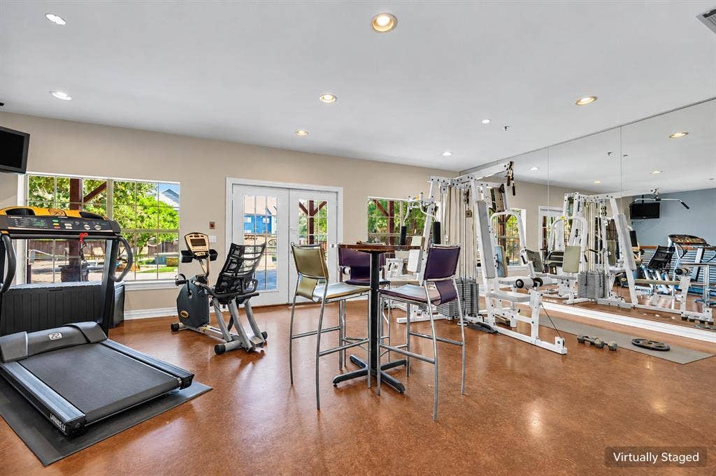 2410 S 2nd Street, #625, Waco, TX 76706 Fitness center featuring high-gloss resilient flooring, wall-to-wall mirrored surfacing, recessed ceiling lighting, and multiple windows providing natural illumination