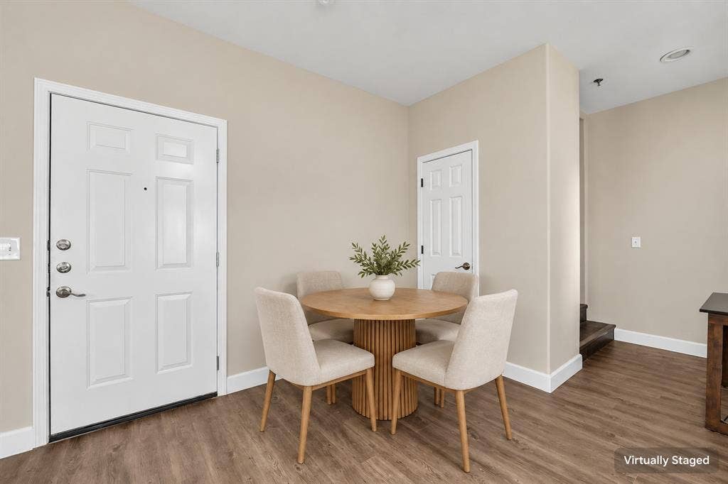 2410 S 2nd Street, #625, Waco, TX 76706 Wood-finish flooring, white paneled entry door with metallic hardware, and white interior doors with traditional molding