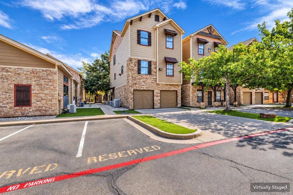 2410 S 2nd Street, #625, Waco, TX 76706 Multi-story exterior featuring stone veneer siding, horizontal lap siding, and attached two-car garages