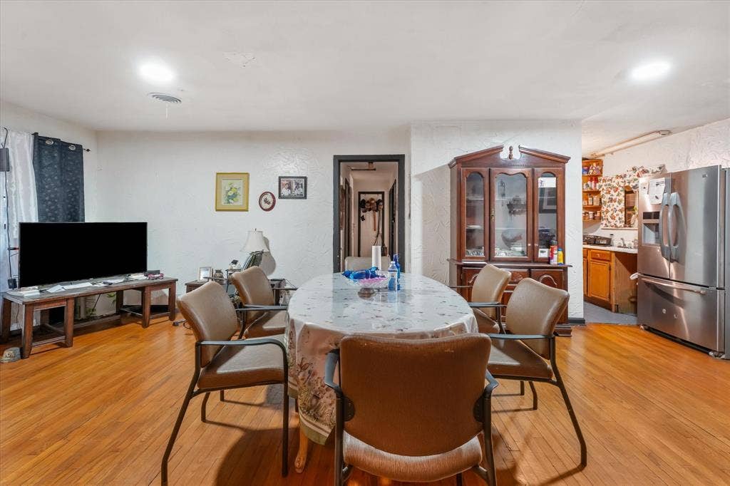 201 Glenridge Drive, Mesquite, TX 75149 Hardwood-finish flooring, recessed lighting, and built-in glass-paneled display cabinetry