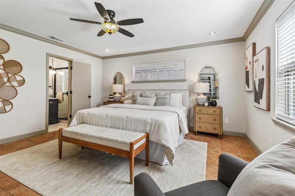 Recessed lighting, ceiling fan with integrated light, tile flooring, crown molding, and an attached bathroom