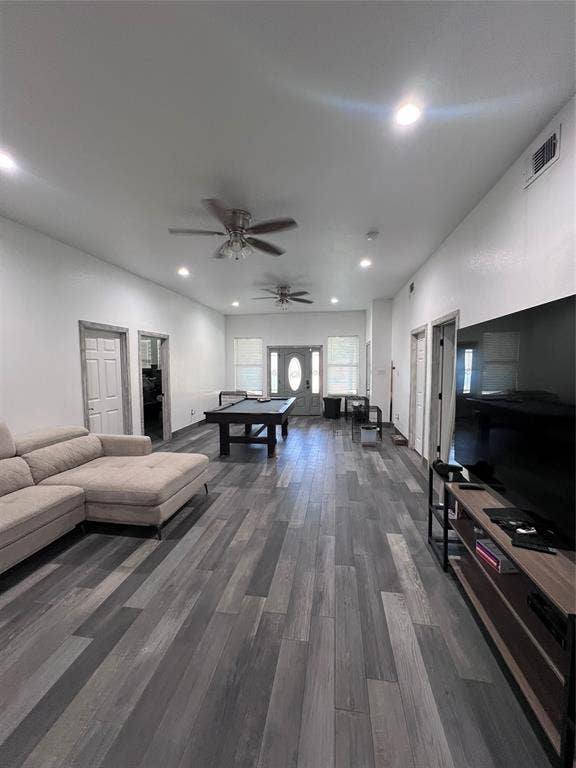 201 Darien Drive, Mesquite, TX 75149 Wood-finish plank flooring, recessed lighting, dual ceiling fans, and an exterior door featuring decorative glass inlay