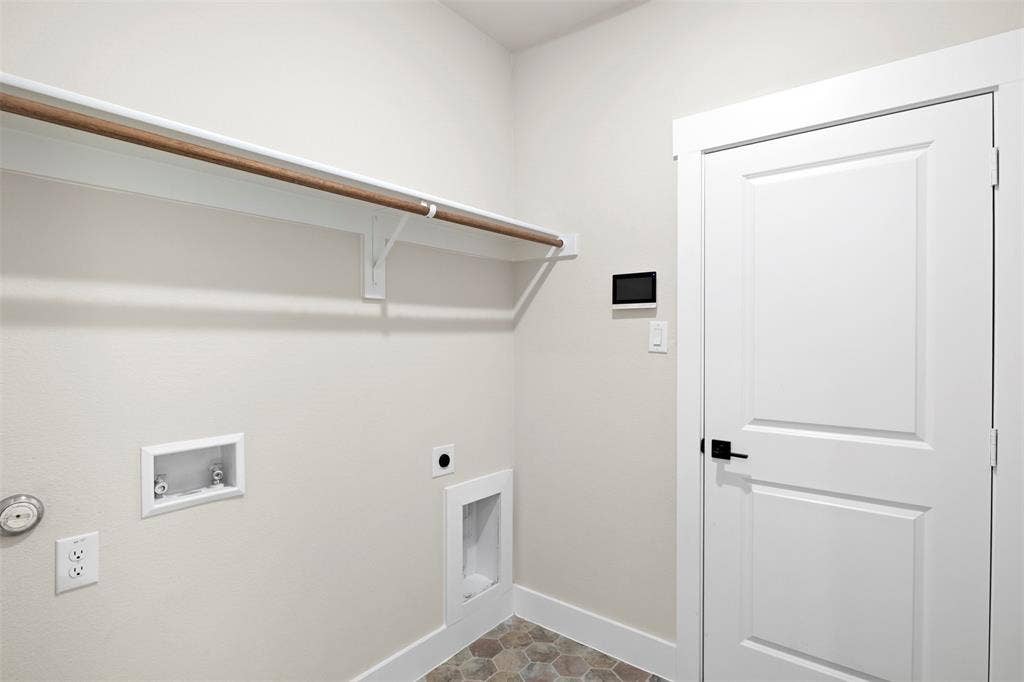 Laundry room with washer and dryer hook ups