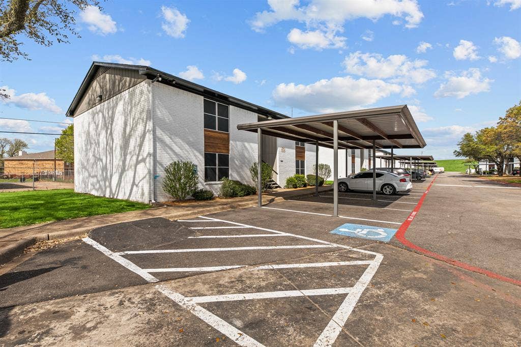 1301 W Hwy 287 ByPass, #106, Waxahachie, TX 75165 Community covered parking at The Ashton on 287. Community view, not the specific exterior or interior of unit 106. Covered parking is optional; confirm availability and charges.