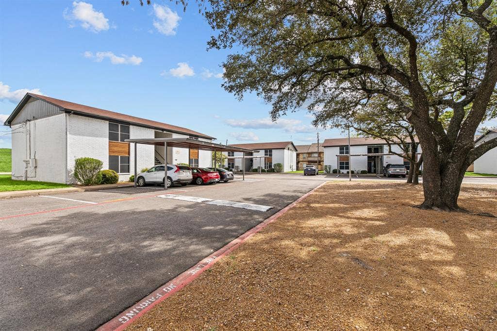 1301 W Hwy 287 ByPass, #106, Waxahachie, TX 75165 Community exterior and drive at The Ashton on 287. Community view, not the specific exterior or interior of unit 106.