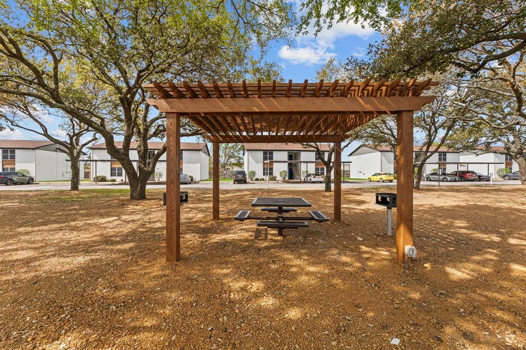 1301 W Hwy 287 ByPass, #107, Waxahachie, TX 75165 Community pergola and picnic area at The Ashton on 287. Community view, not the specific exterior or interior of this unit.