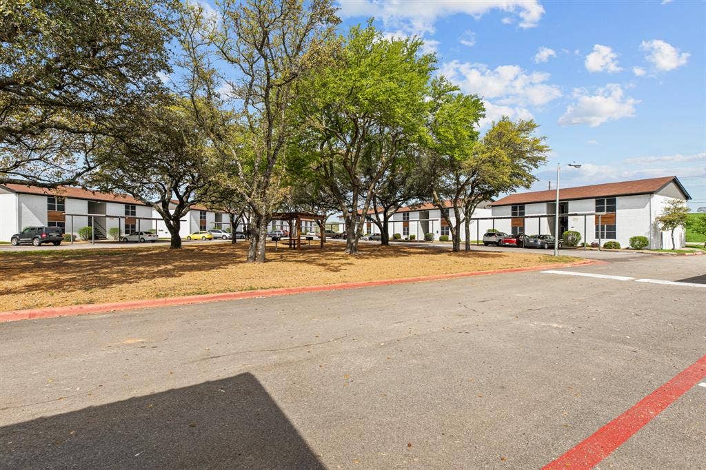1301 W Hwy 287 ByPass, #117, Waxahachie, TX 75165 Community grounds and courtyard at The Ashton on 287. Community view, not the specific exterior or interior of this unit.
