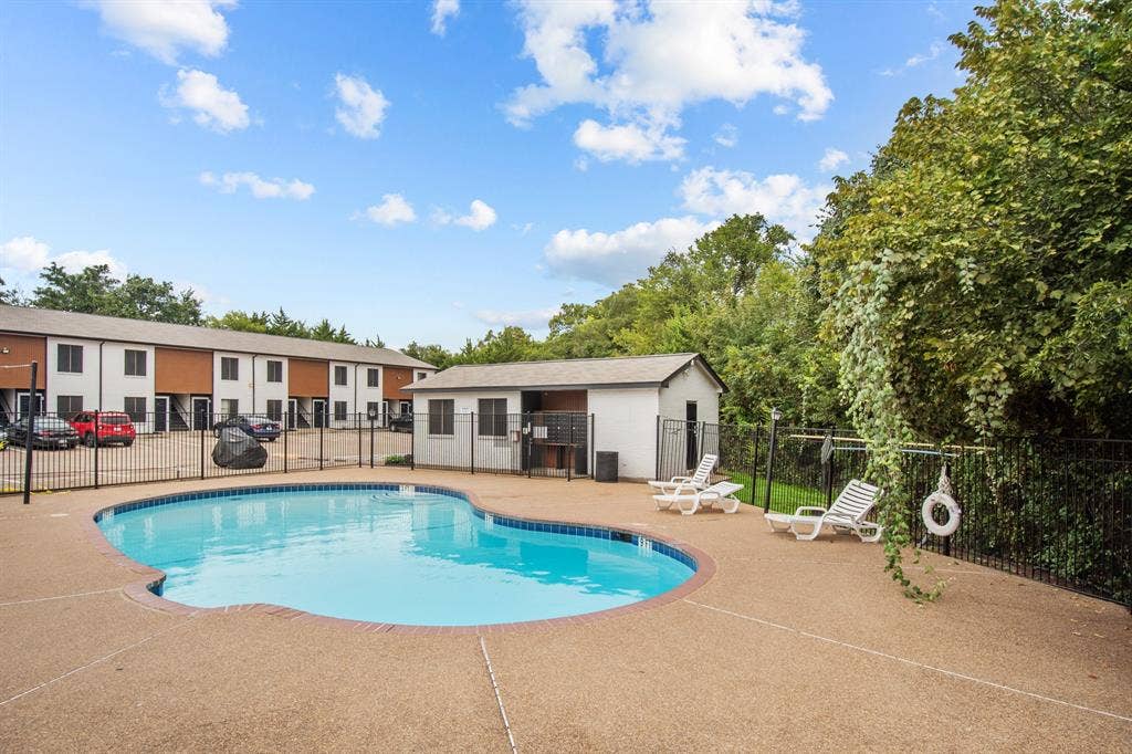 151 E Little Creek Road, #A-05, Cedar Hill, TX 75104 Little Creek community pool and seating area. Community view, not the interior of unit A-05.