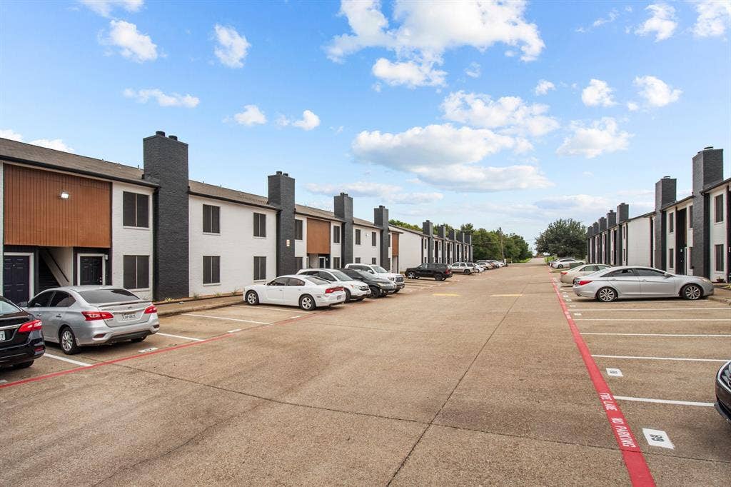 151 E Little Creek Road, #E-10, Cedar Hill, TX 75104 Little Creek community exterior and parking area. Community view, not the interior of unit E-10.