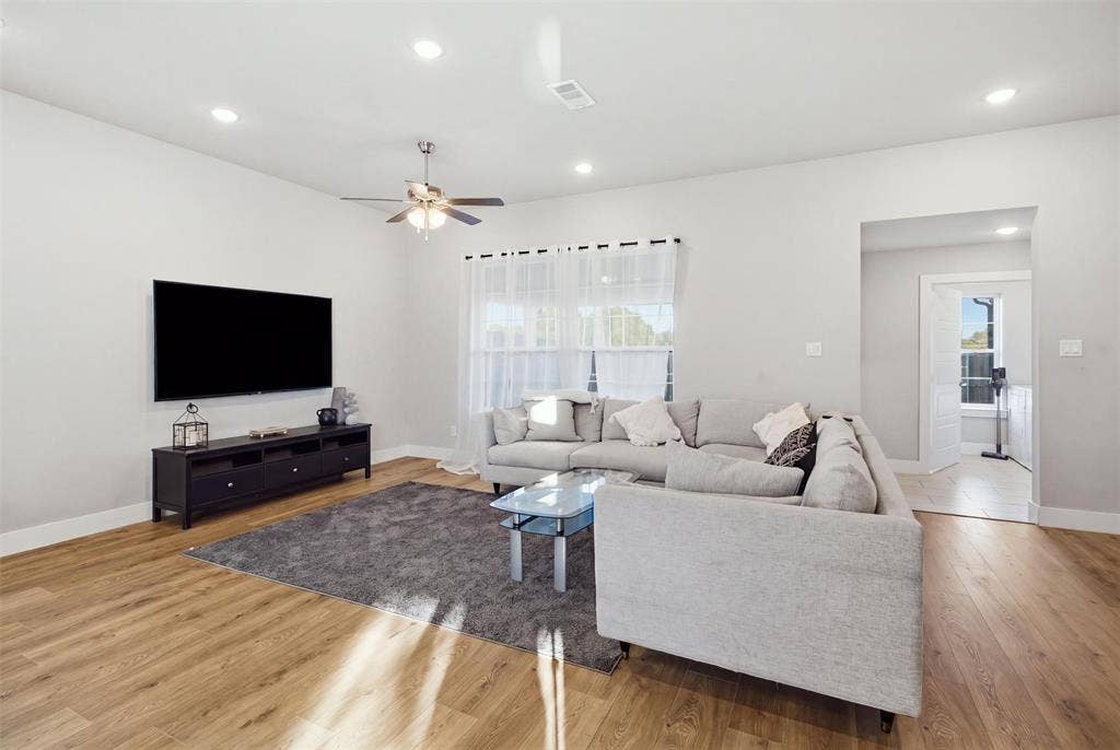 1408 Rockcliff Street, Plano, TX 75093 Living area featuring wood-finish flooring, recessed lighting, and a ceiling fan