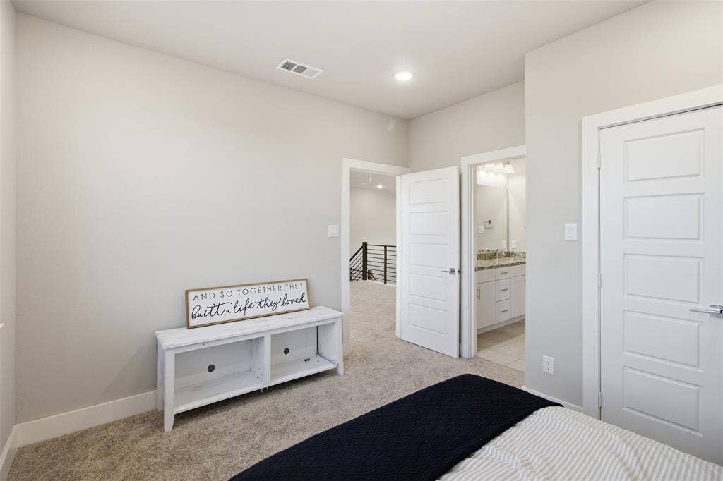 1408 Rockcliff Street, Plano, TX 75093 Neutral-toned interior featuring wall-to-wall carpeting, five-panel doors, recessed lighting, and built-in vanity cabinetry