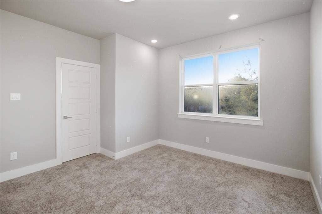 1408 Rockcliff Street, Plano, TX 75093 Neutral-toned interior featuring wall-to-wall carpeting, recessed ceiling lighting, and a multi-panel interior door