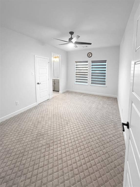 2251 Macy Way, Prosper, TX 75078 Interior room featuring textured carpet flooring, dual windows with adjustable roller shades, and a ceiling fan with integrated lighting