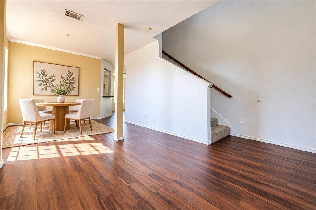 2709 Maci Court, Seagoville, TX 75159 Wood-finish flooring throughout, staircase with a handrail, and structural pillar