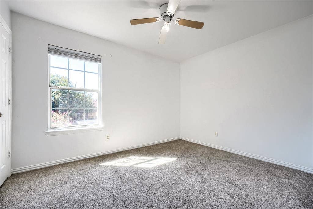 2709 Maci Court, Seagoville, TX 75159 Neutral-toned wall-to-wall carpeting, multi-pane window with integral blinds, and overhead ceiling fan with light fixture