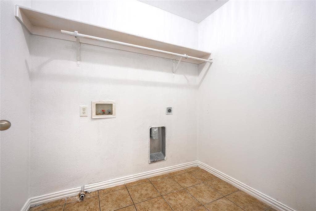 2709 Maci Court, Seagoville, TX 75159 Utility area featuring ceramic tile flooring, a built-in overhead shelf, and an integrated hanging rod