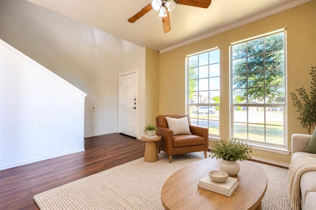 2709 Maci Court, Seagoville, TX 75159 Living area featuring wood-finish flooring, two large paneled windows, high ceilings, and a ceiling fan