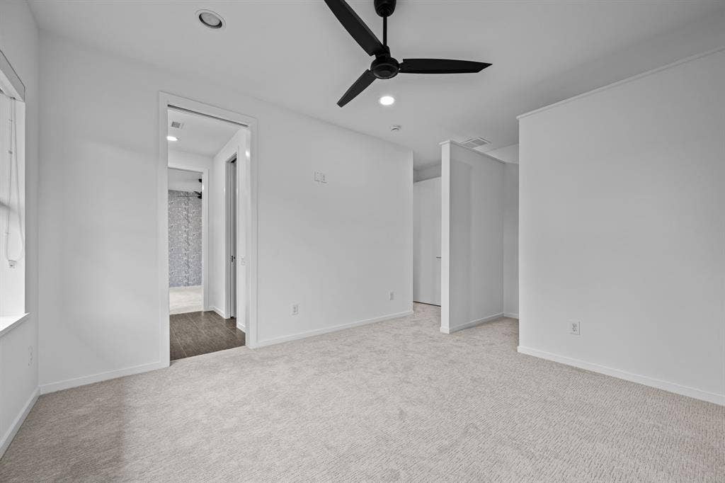 Direct access to the shared Hollywood bath adds convenience to this secondary bedroom.