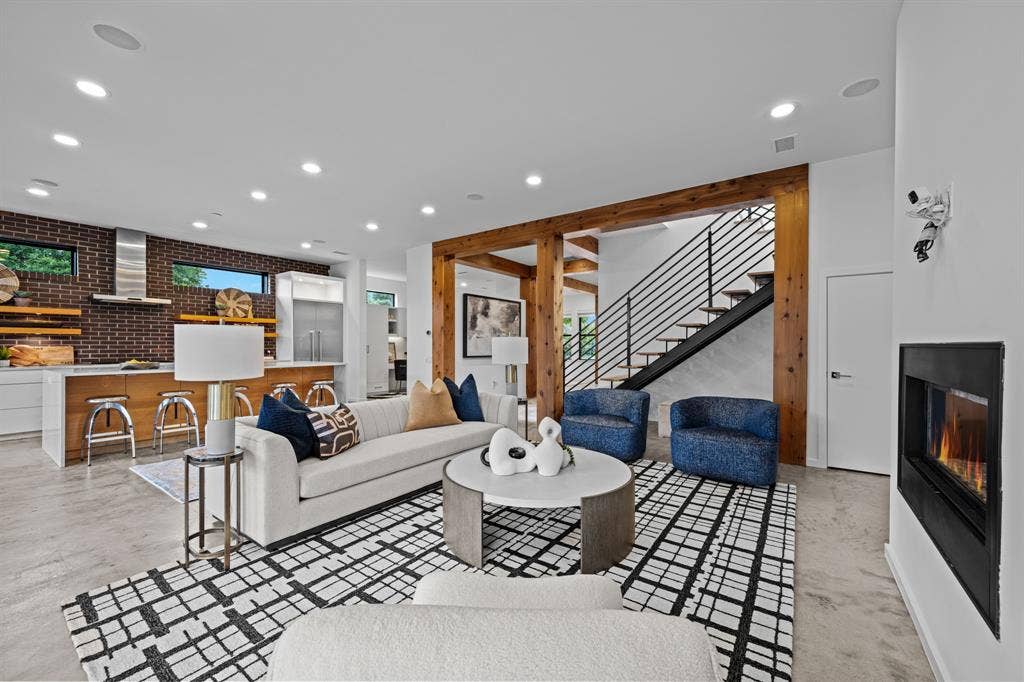 Warm timber framing and a floating staircase give everyday living an architectural point of view.