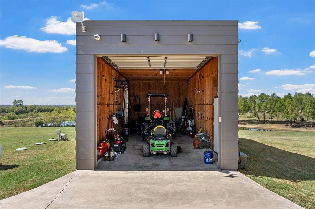 356 Bold Springs Court, West, TX 76691 Detached structure featuring horizontal lap siding, concrete flooring, 10 foot roll down door with app and wifi enabled opener.