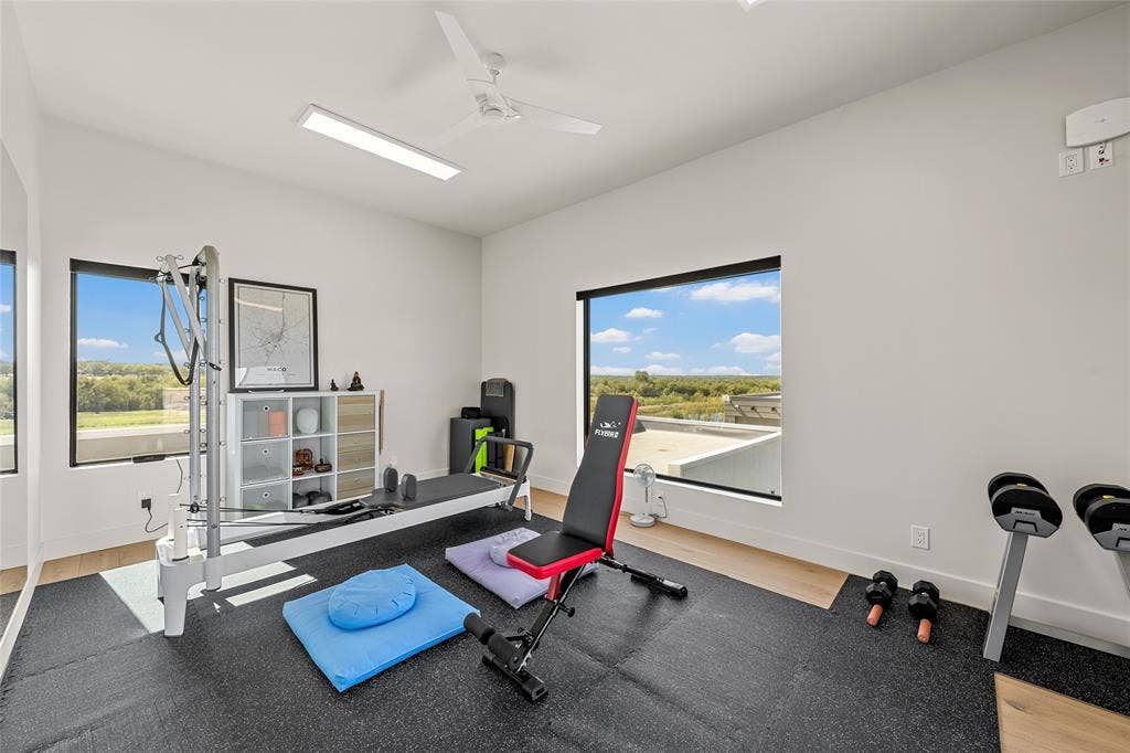 356 Bold Springs Court, West, TX 76691 Large picture windows, wood flooring, ceiling fan, recessed lighting, and access to balcony from expansive sliding doors.