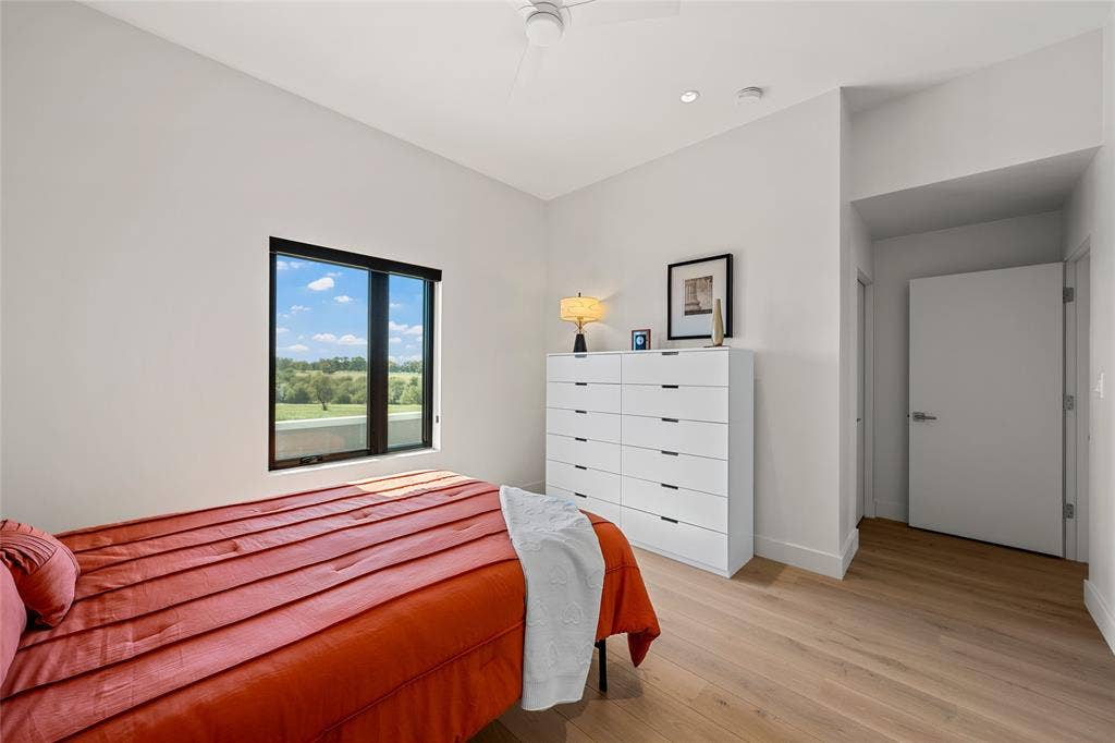 356 Bold Springs Court, West, TX 76691 Neutral-toned walls, wood flooring, recessed lighting, ceiling fan, and egress window and large walk in closet
