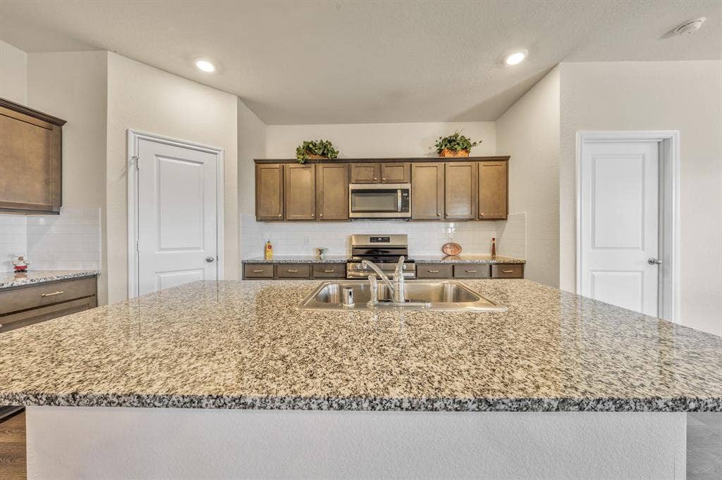 1996 Ocelot Street, Crandall, TX 75114 Kitchen has granite counters