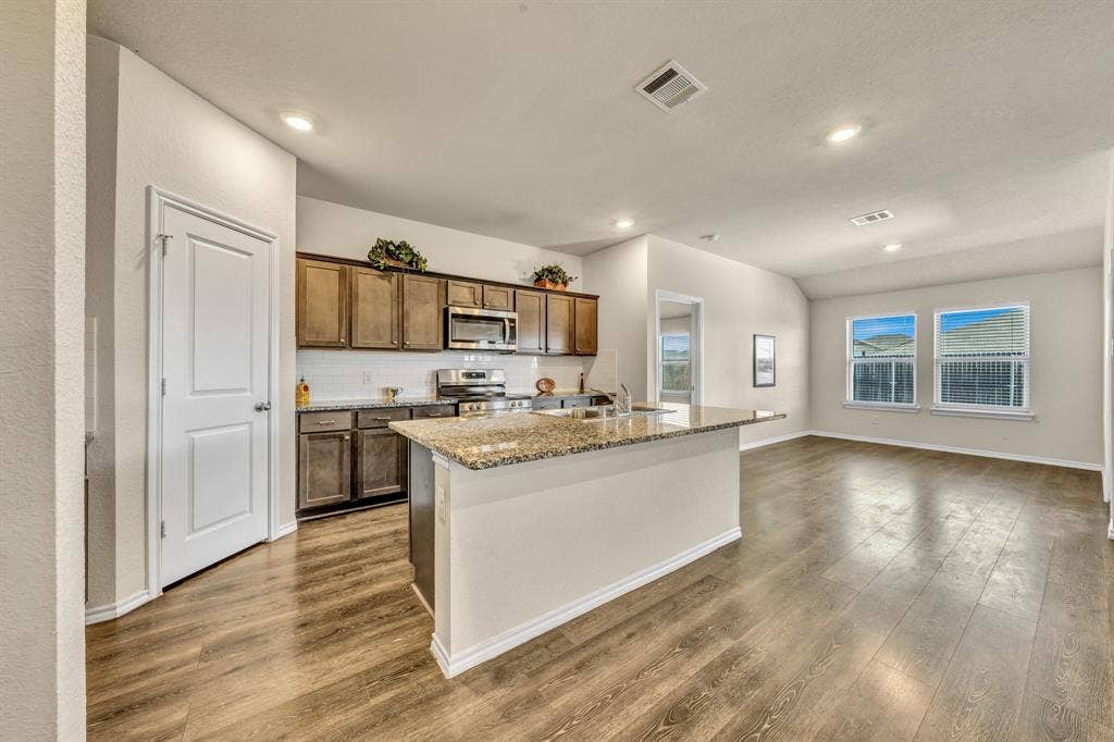 1996 Ocelot Street, Crandall, TX 75114 Kitchen has a walk in pantry on the left