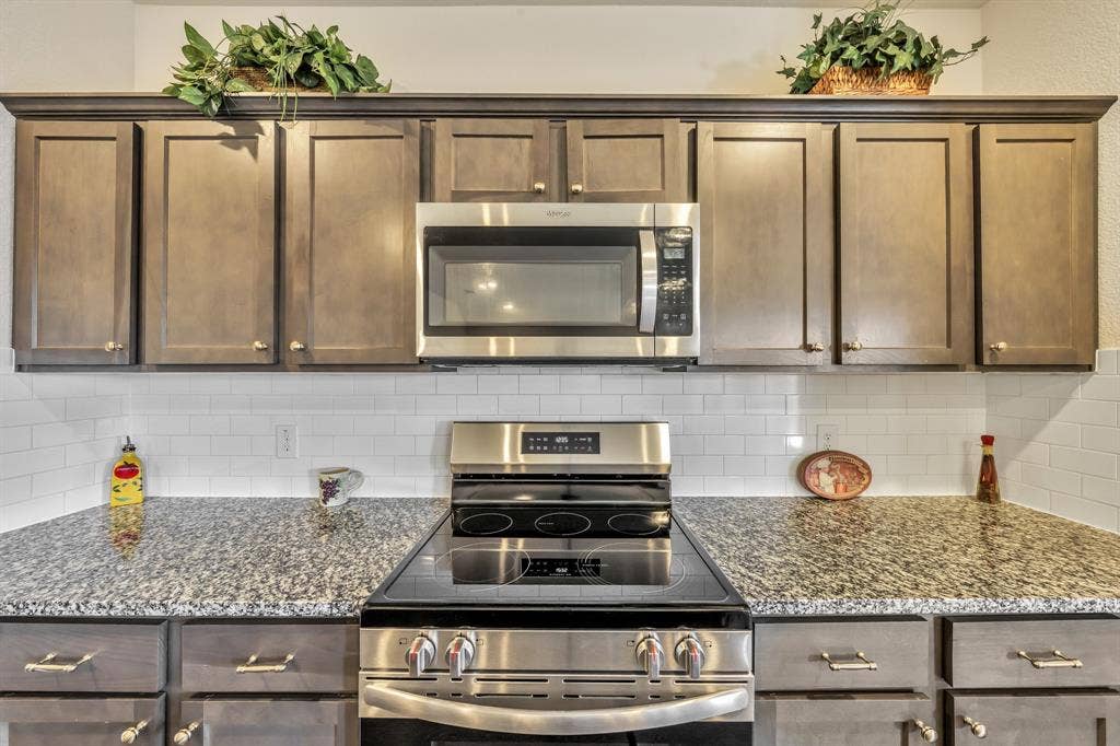 1996 Ocelot Street, Crandall, TX 75114 Five burner electric stove - New in October 2026