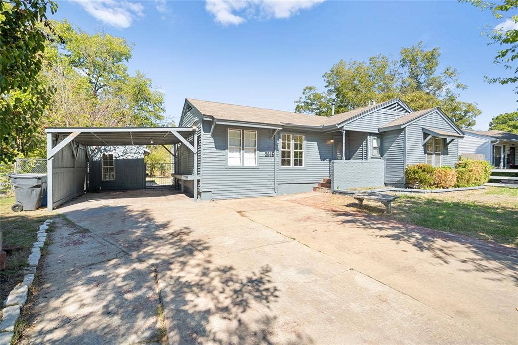 2005 Tisinger Avenue, Dallas, TX 75228 Single-story residence featuring horizontal lap siding, a covered carport, and a concrete driveway