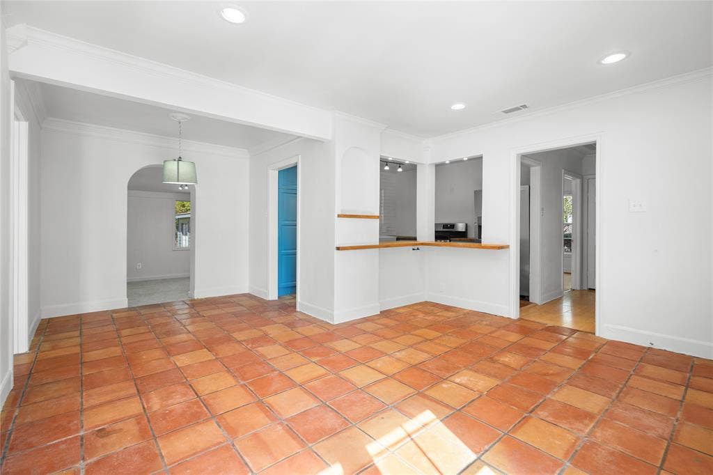 2005 Tisinger Avenue, Dallas, TX 75228 Interior space featuring terracotta tile flooring, recessed lighting, archway, and wood-topped counter