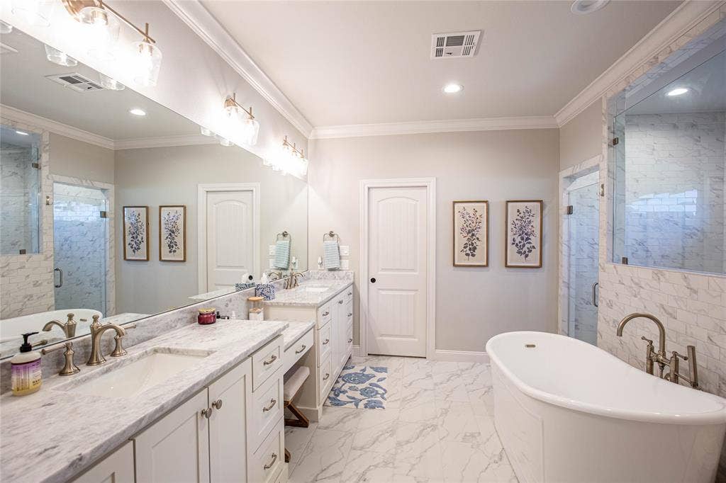 Dual sinks plus a make up vanity.