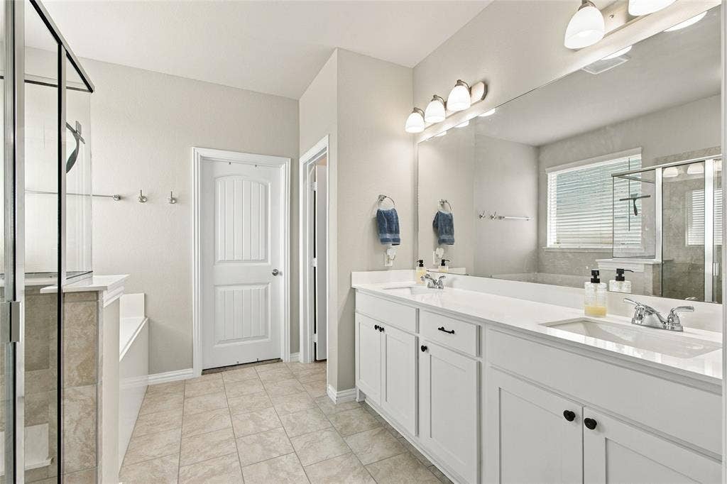1138 CR 138 Road, Oak Ridge, TX 75161 Separate tub and shower and plenty of room for your bathroom items.
