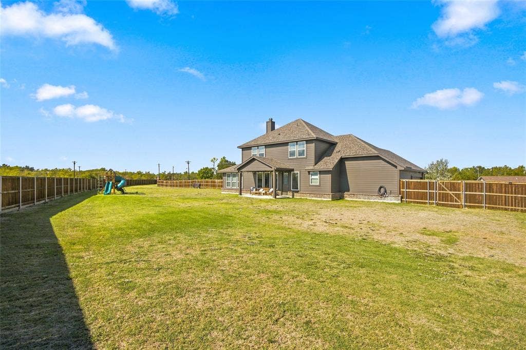 1138 CR 138 Road, Oak Ridge, TX 75161 Nearly an acre, surrounded by wooden privacy fence