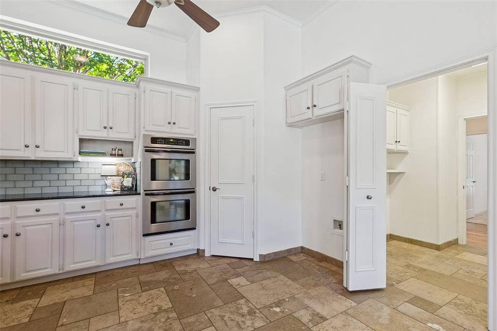 Laundry room is conveniently located between kitchen and SE hallway