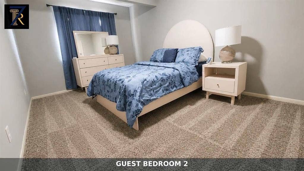 Neutral interior room featuring textured carpeting and light-toned wall paint