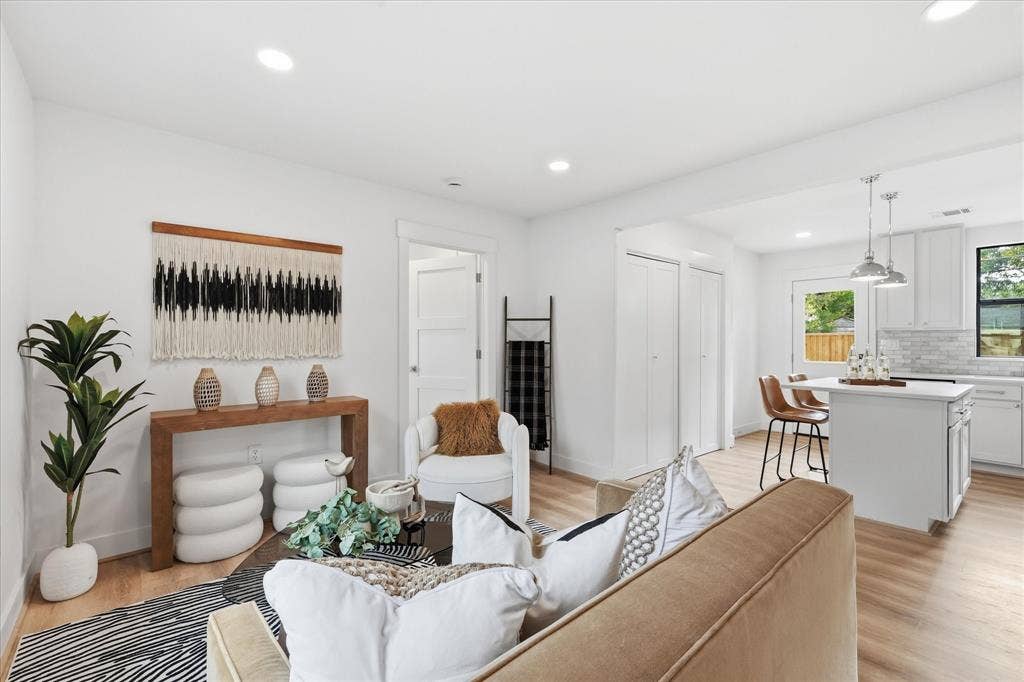 11624 Rupley Lane, Dallas, TX 75218 Open-concept interior featuring wood-finish flooring, recessed lighting, and a kitchen island with pendant lighting