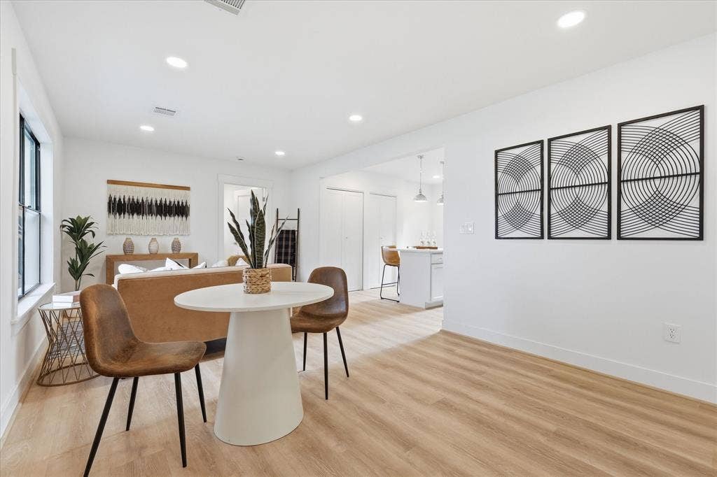 11624 Rupley Lane, Dallas, TX 75218 Neutral-toned interior featuring wood-finish flooring, recessed lighting, and crisp white walls
