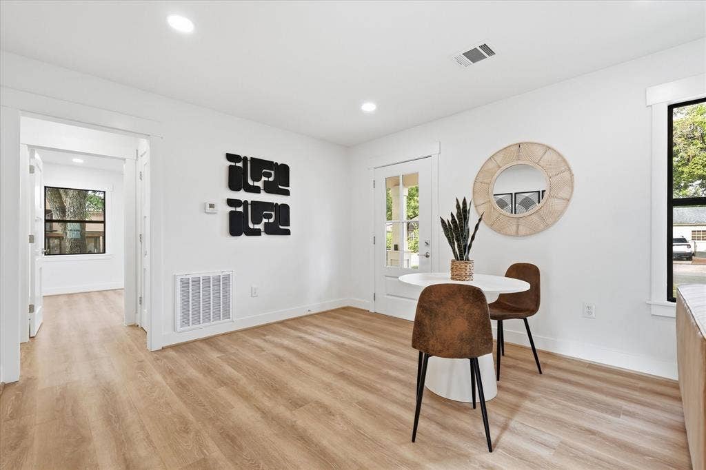 11624 Rupley Lane, Dallas, TX 75218 Light-filled room featuring wood-finish flooring, recessed lighting, and a glass-paneled exterior door