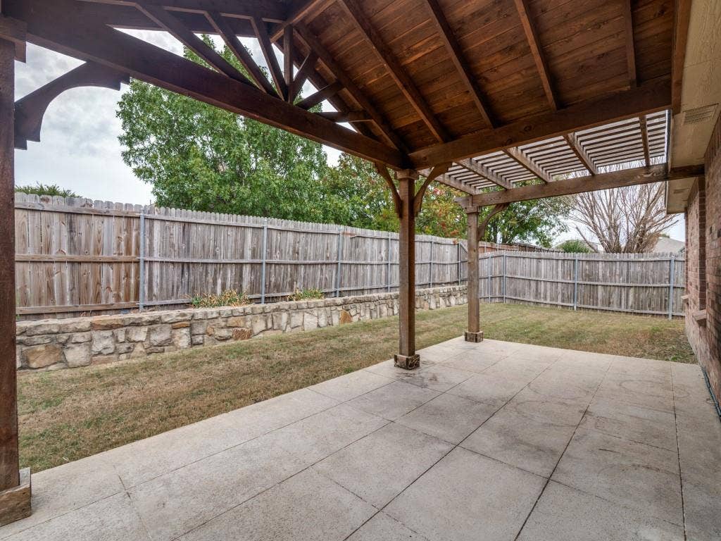 Custom timber-framed outdoor living area with vaulted gabled roof and pergola-style extension
